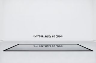 Shallow Water [Shallow Water No Diving] (2010) Medium: Installation, vinyl lettering on wall, mirror on floor Dimensions variable.