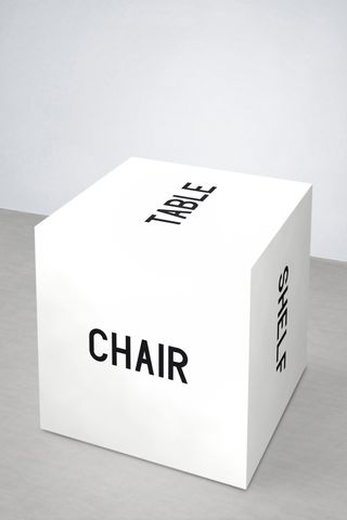 Text-based design object, a piece of multipurpose wooden furniture with black lettering. Part of What Is Philosophy series